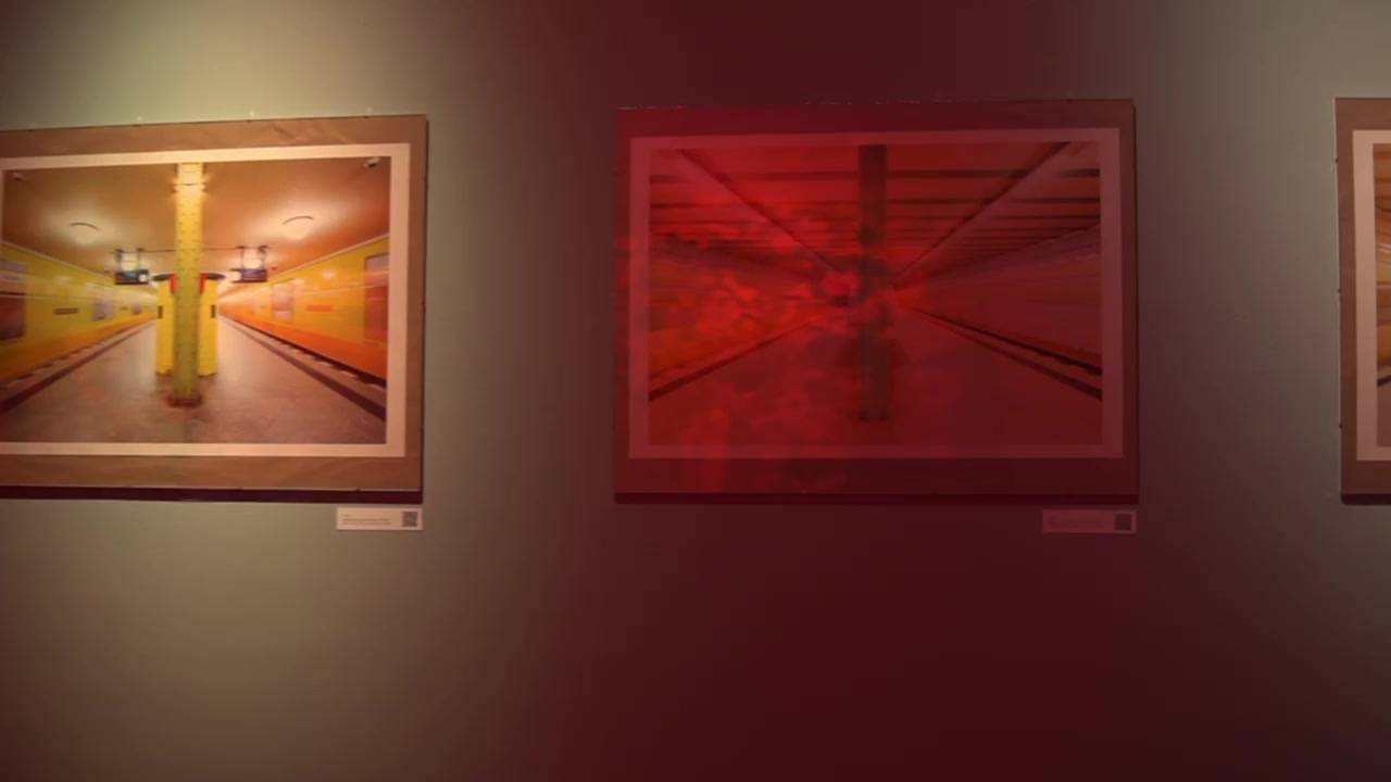 Framed works on the gallery wall at FREIRAUM Berlin in warm light